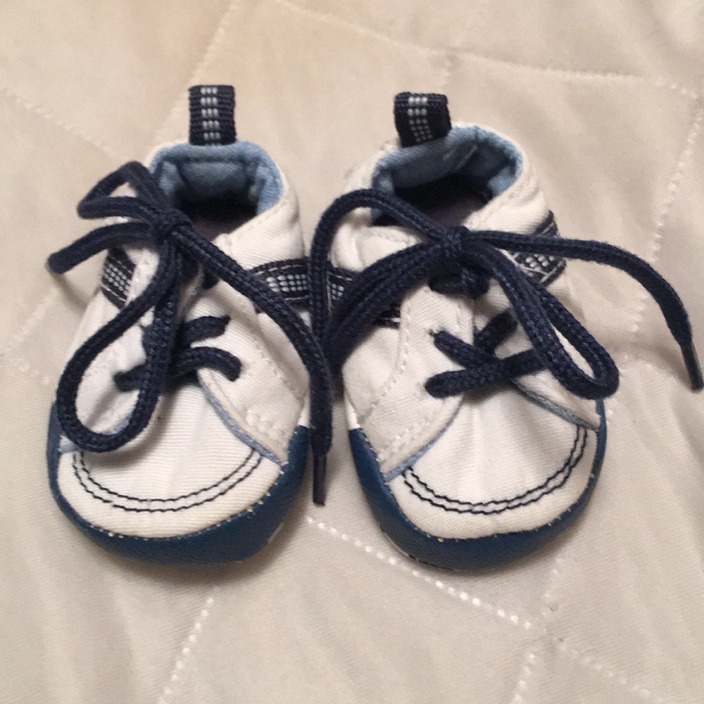 Navy blue and white baby tennis shoes. Size 0